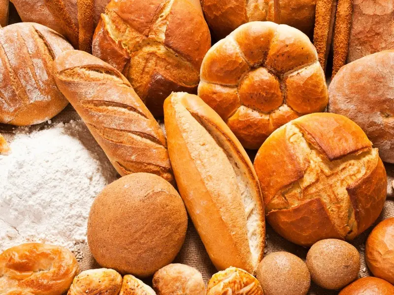 Artisan breads and flour on burlap